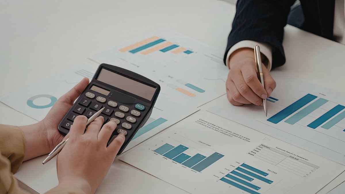 A frustrated business leader reviewing shifting sales forecast projections at their desk, illustrating how sales forecasting problems develop when pipeline stages lack consistent definitions and buying conditions
