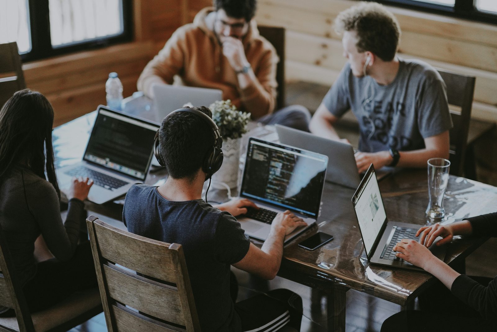 Sales team implementing new technology solutions while collaborating at modern workspace